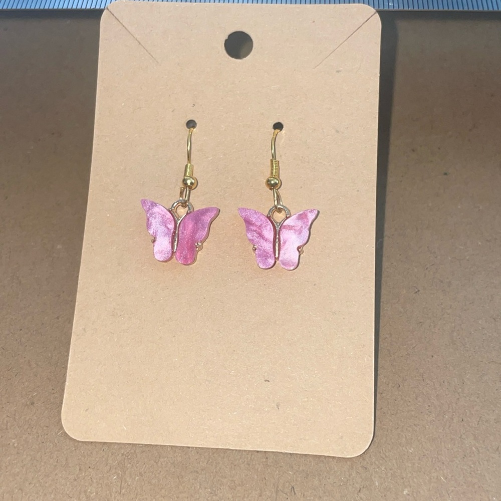 Homemade pink butterfly gold earrings with plastic backing